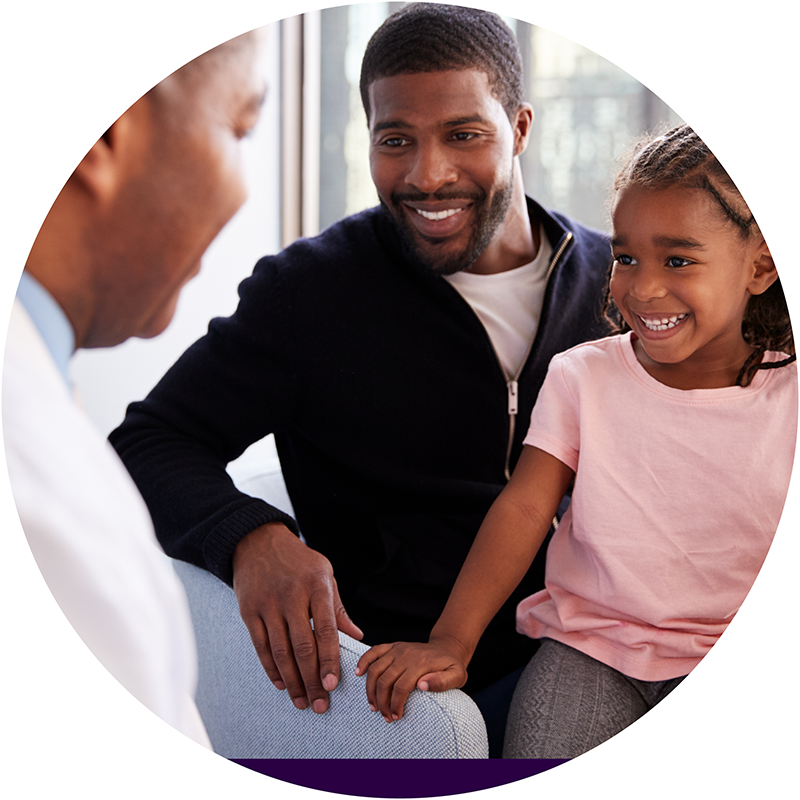 Father and Daughter Visiting Doctor